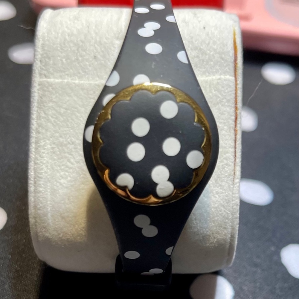 Polka Dot Black and Gold Kate Spade fitness and sleep tracker.